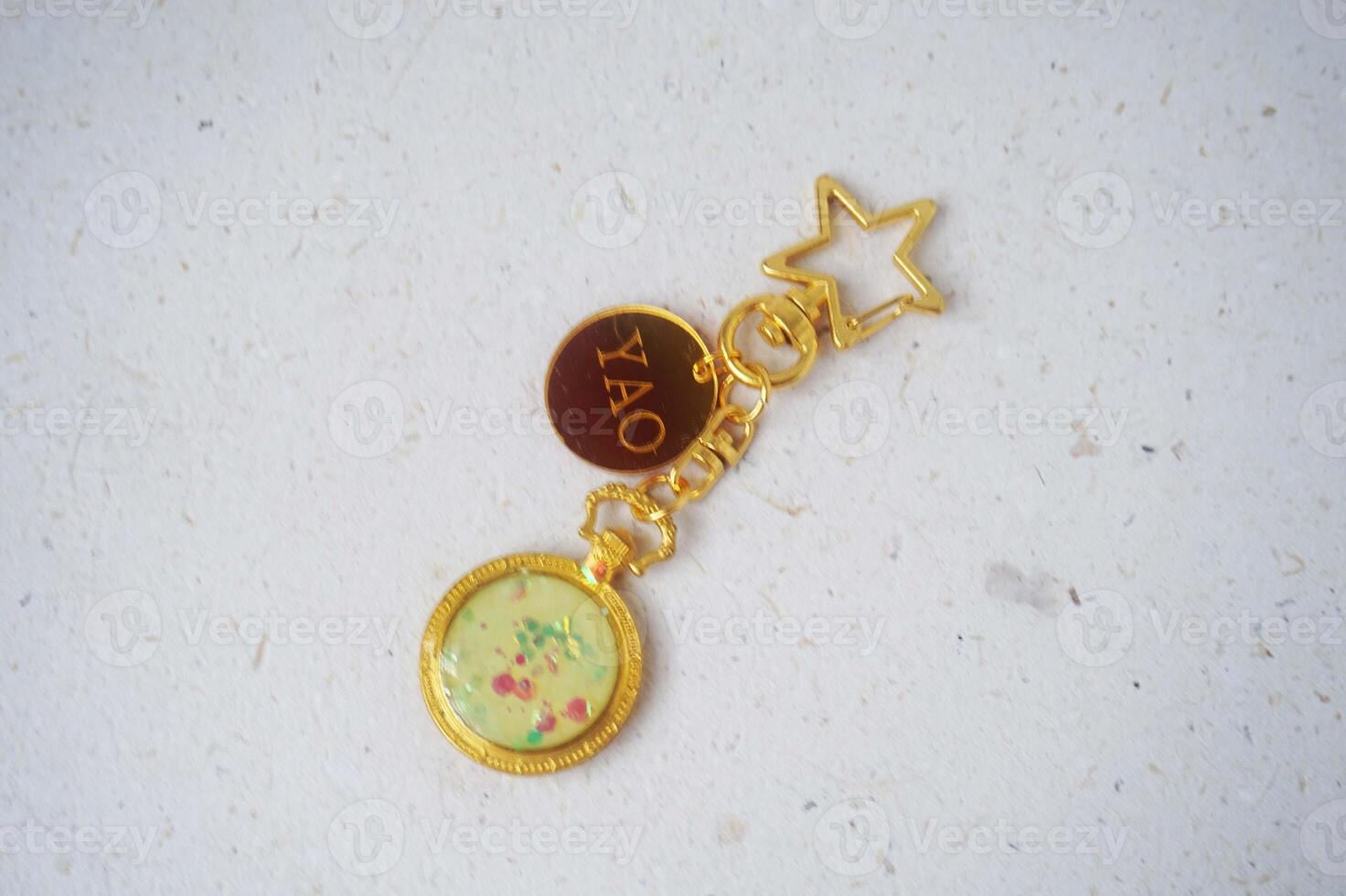 Colorful key chain made of resin and clay on a white background. Colorful key chain photo
