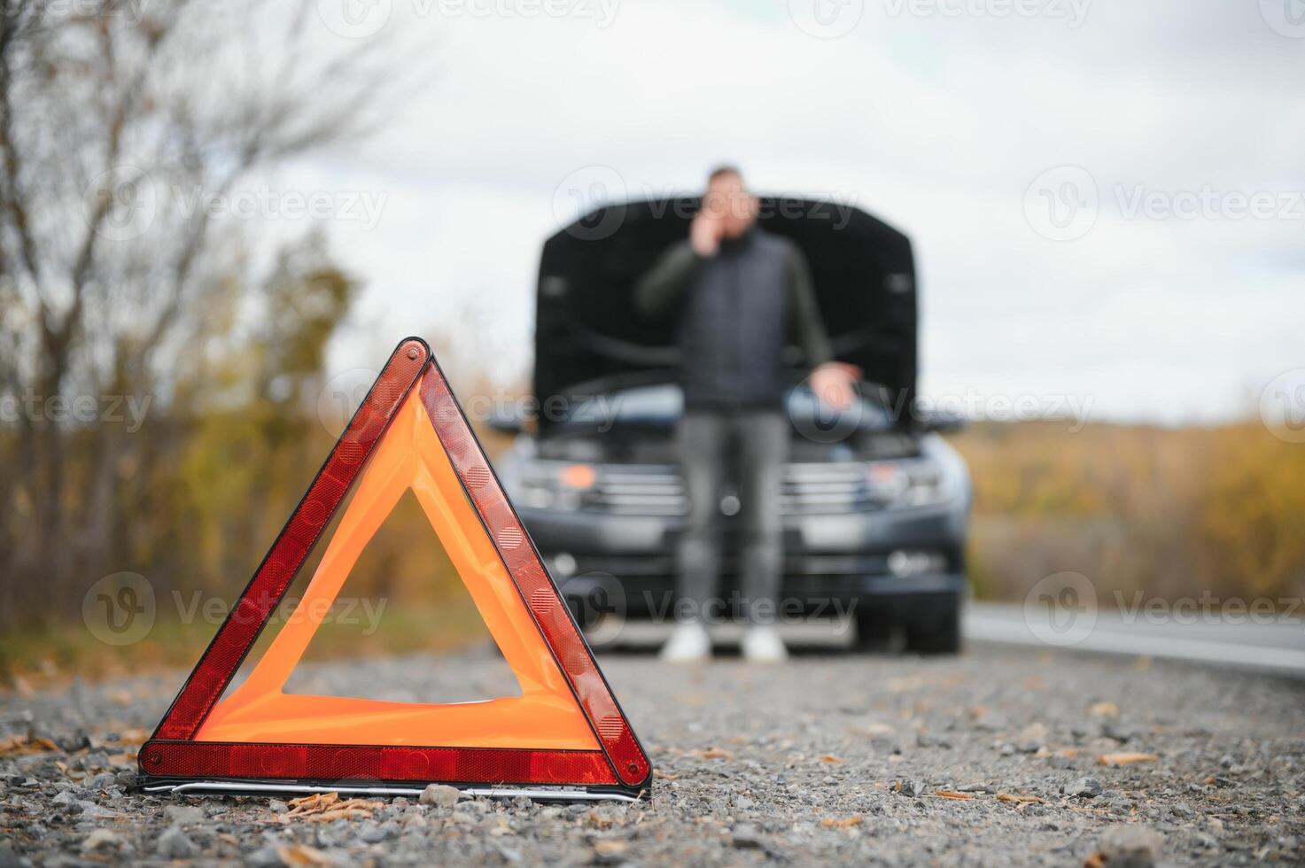 car broke down on the road, a man calls the emergency service, a tow truck. photo