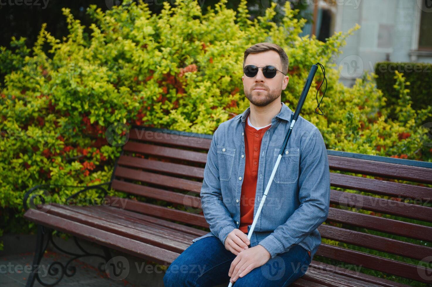 Blind man. People with disability, handicapped person and everyday life. Visually impaired man with walking stick. photo