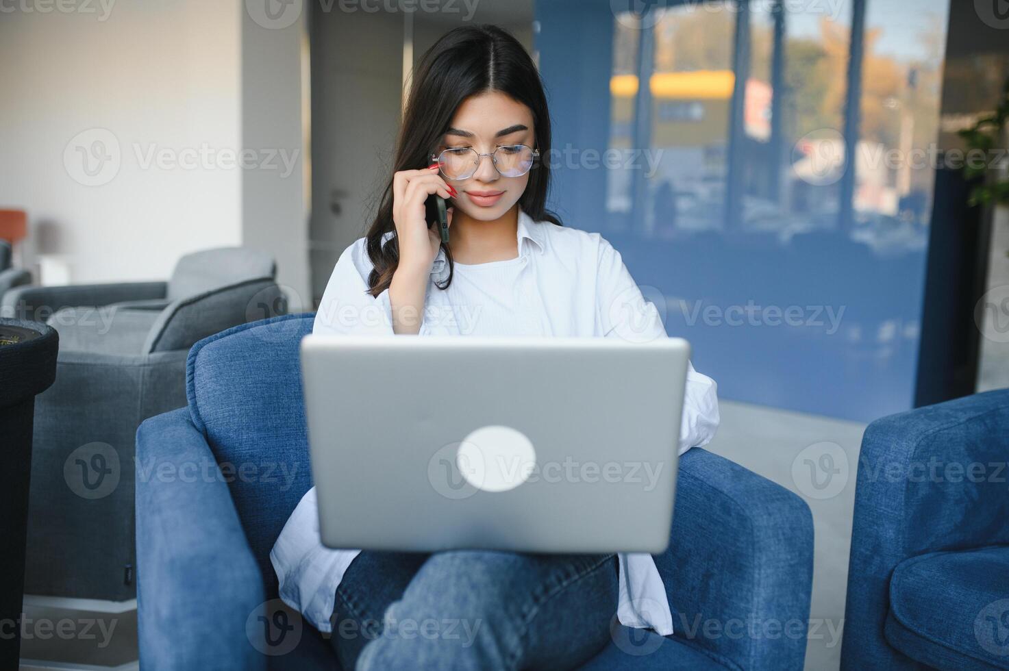Joyful girl student studying online at cafe, using laptop and earphones, empty space photo
