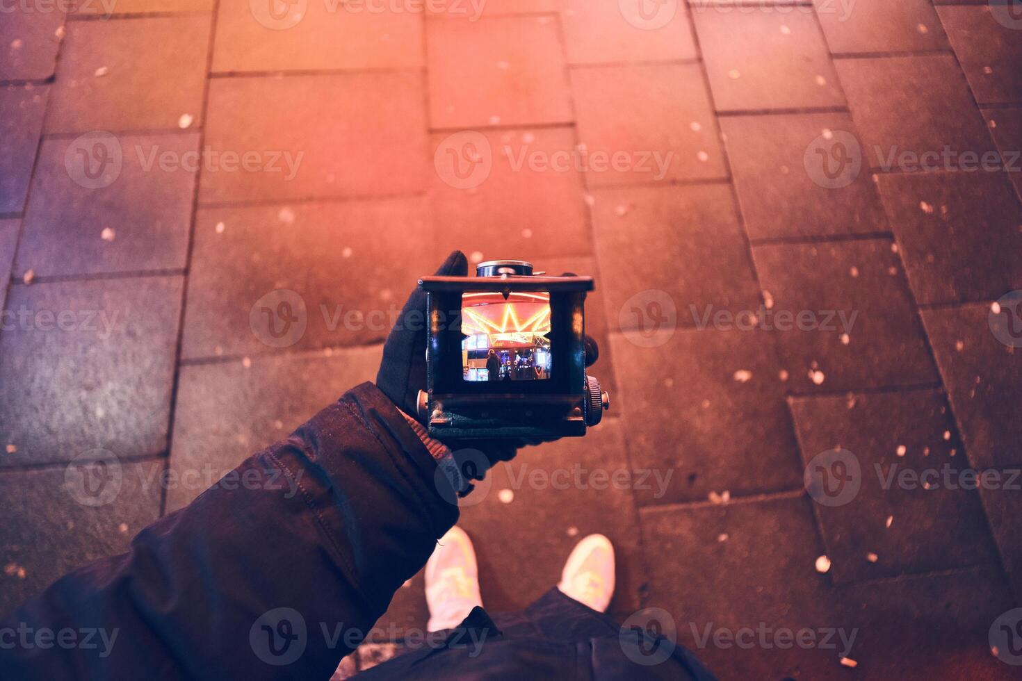 Looking through viewfinder of vintage TLR Camera photo