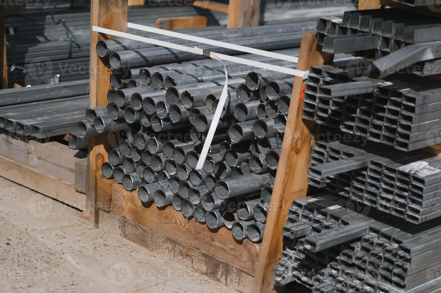 Stack of rolled metal products, perspective view of steel pipes of rectangular cross-section photo