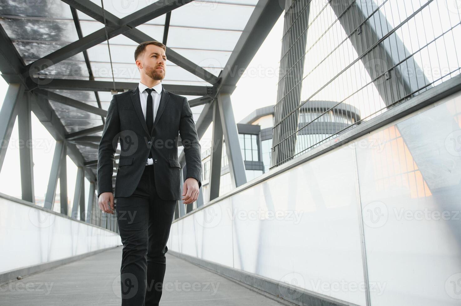 Portrait of an handsome businessman in an urban setting photo