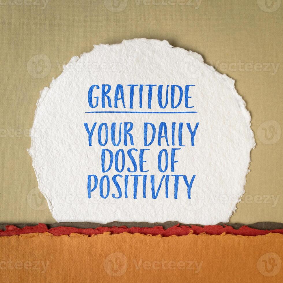 gratitude - your daily dose of positivity, inspirational reminder note on art paper photo