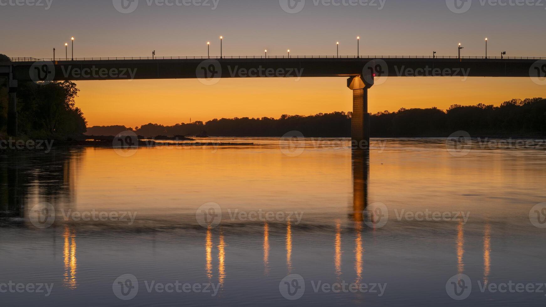 silhouette of the bridge over Missouri River at Hermann, MO, after sunset photo