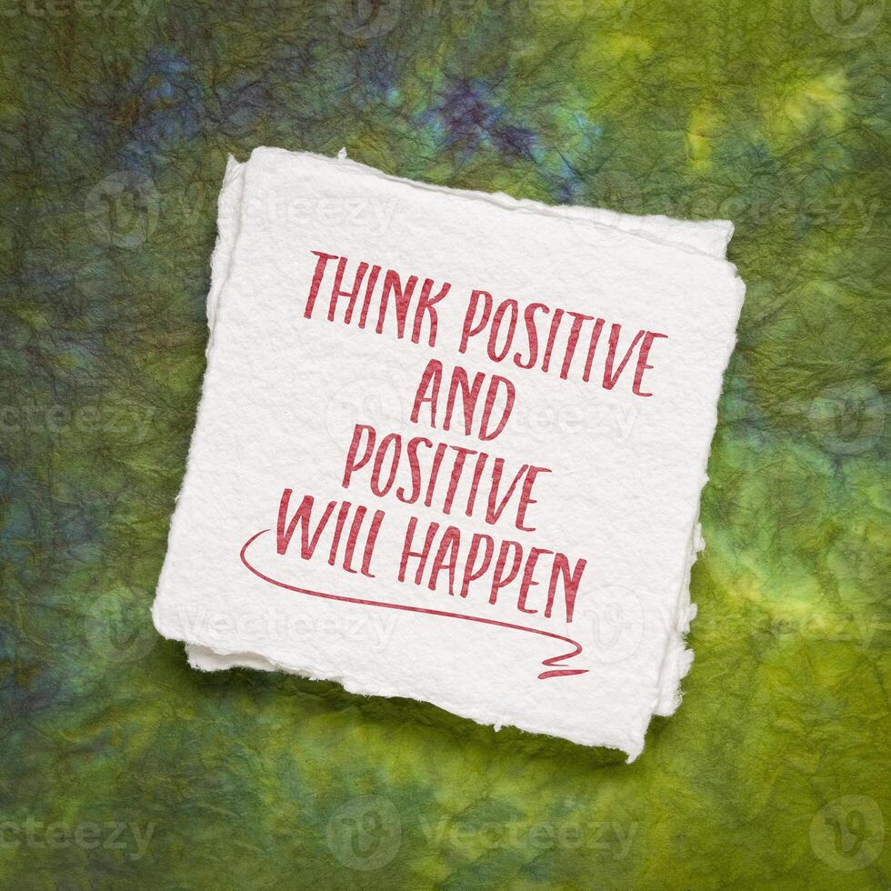 think positive and positive will happen - inspirational note on art paper, mindset and attitude concept photo