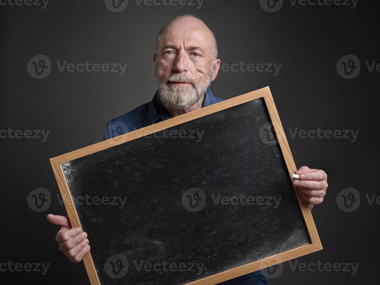 senior man, teacher, mentor or presenter, with blank blackboard, education, presentation and business communication concept photo