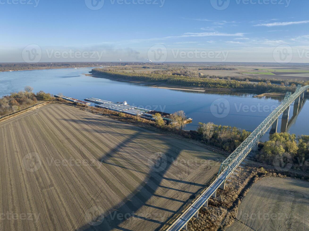 bridge and barges on the Mississippi  River at confluence with the Ohio River below Cairo, IL, November aerial view photo