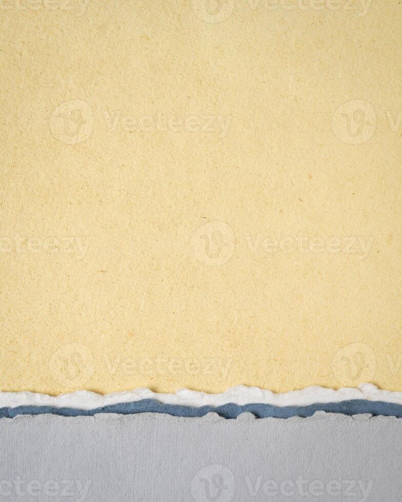 abstract paper landscape in yellow and gray pastel tones - collection of handmade rag papers photo