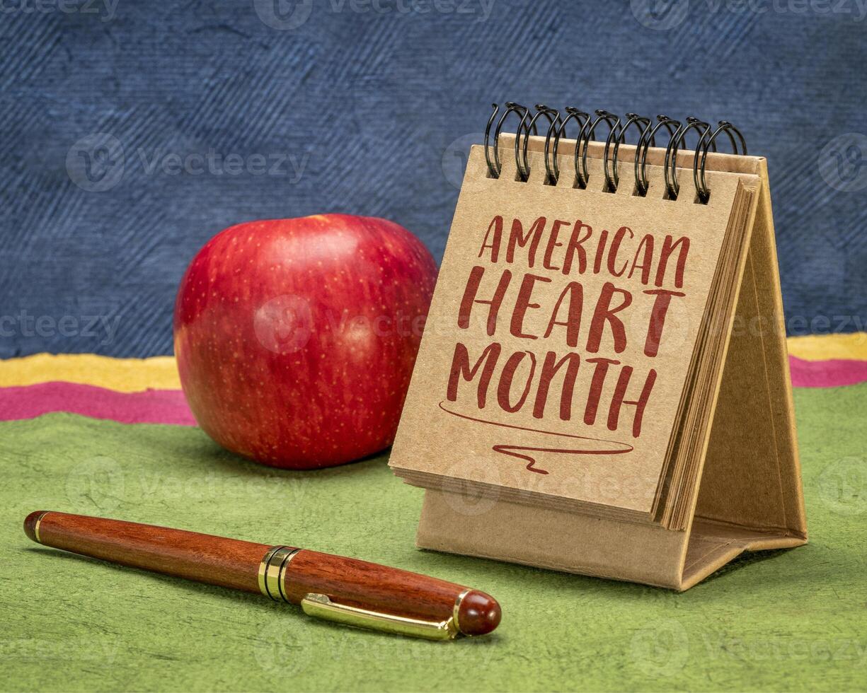 American Heart Month - observance held annually in February, reminder note in a desktop calendar, cardiovascular health concept. photo