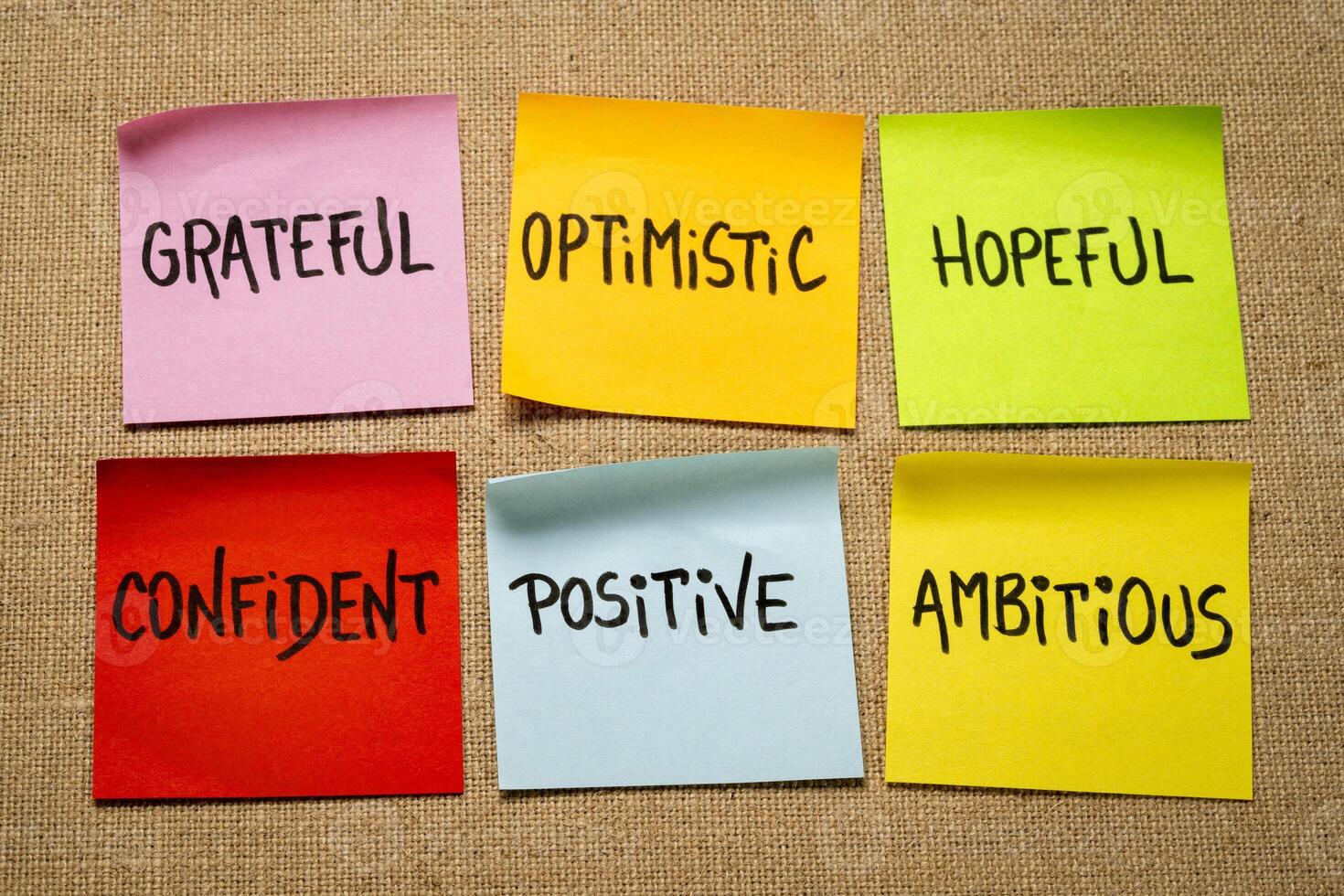 inspirational power words - grateful, optimistic, hopeful, confident, positive and ambitious - set of sticky reminder notes against burlap canvas photo