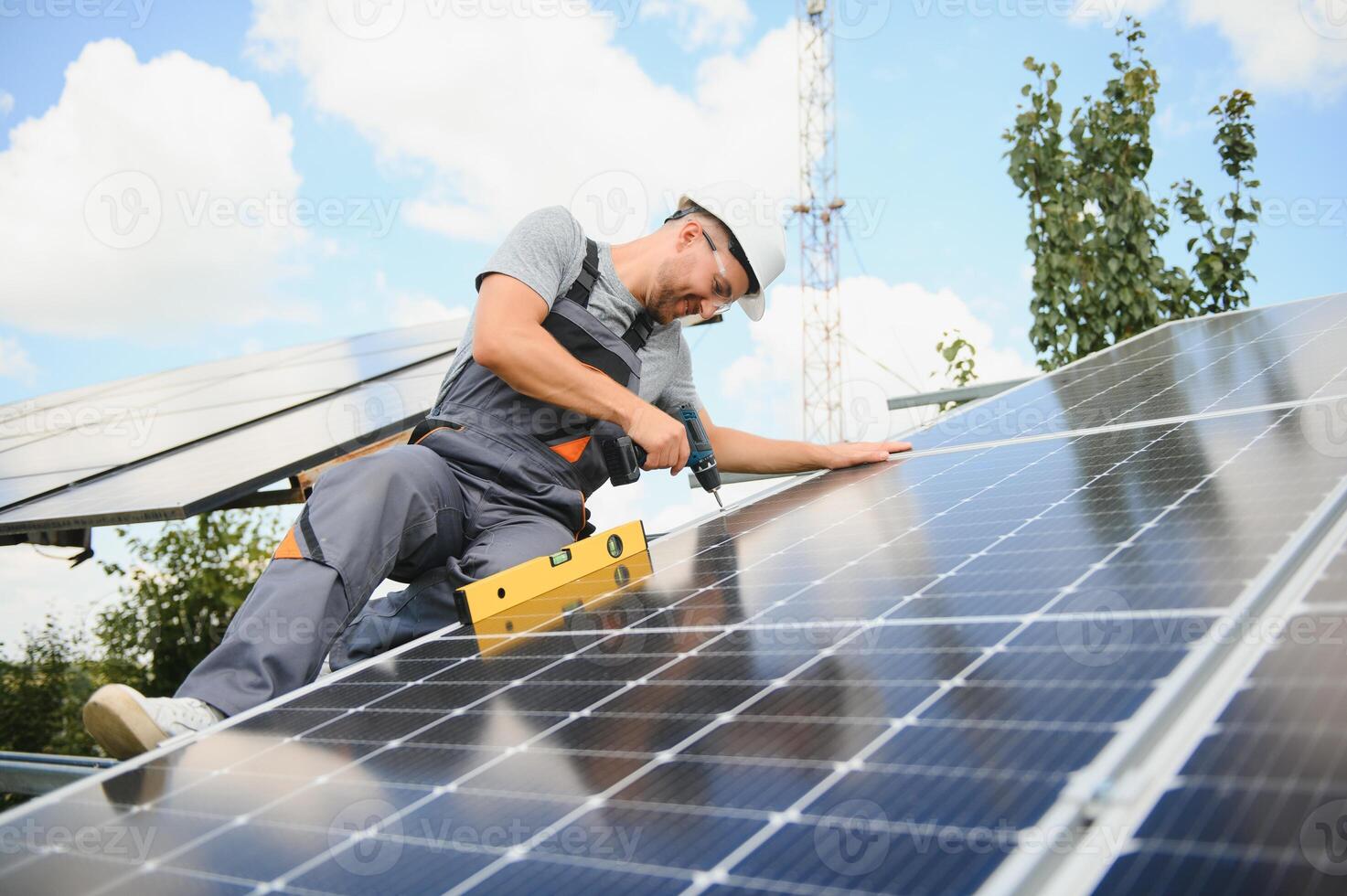 A man working at solar power station. photo