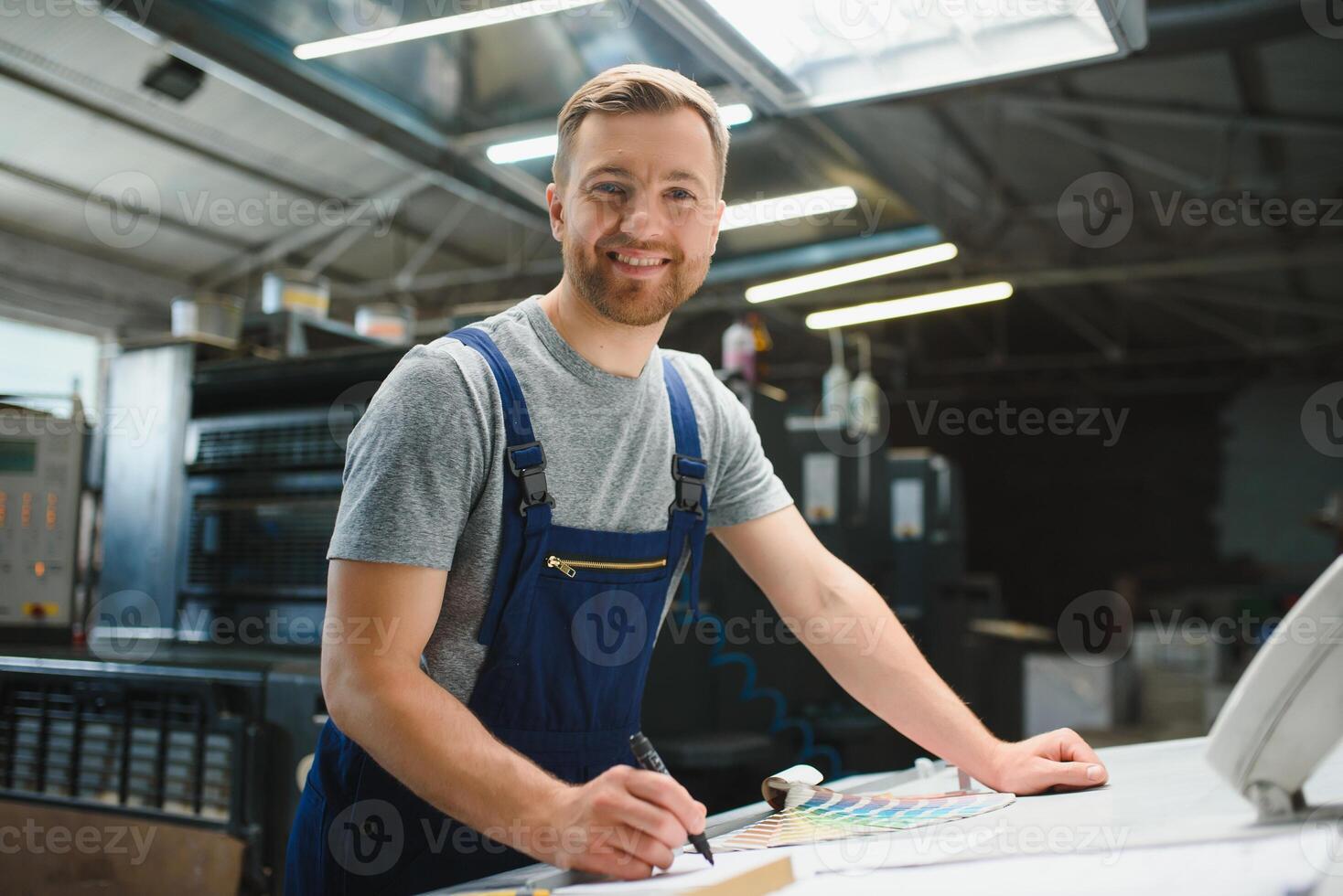 worker in factory on the machine photo