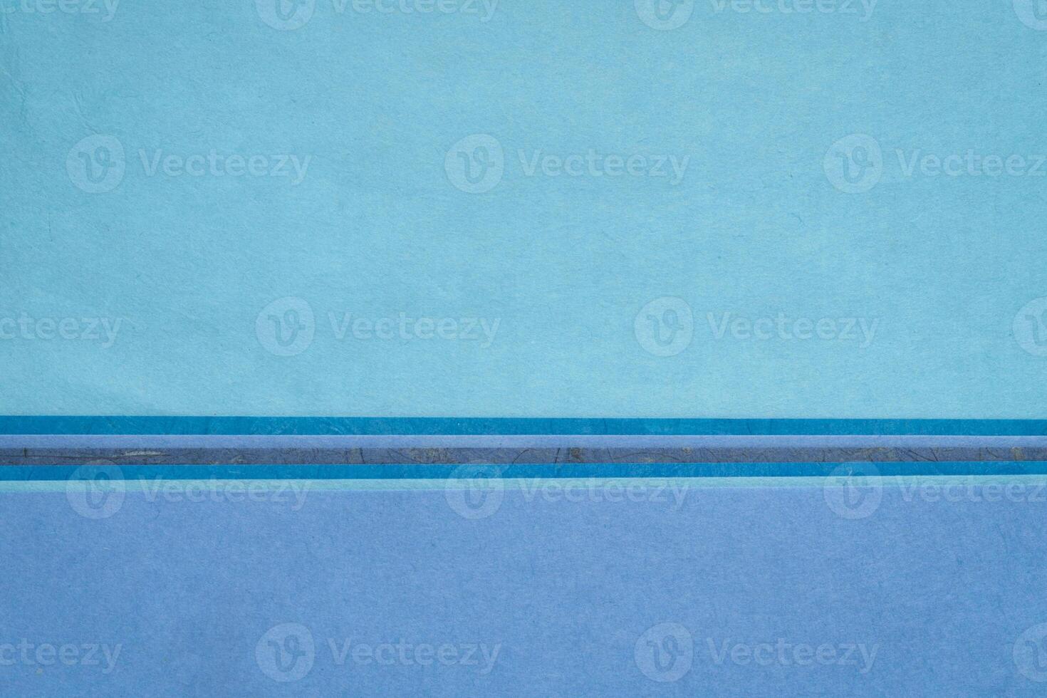 abstract landscape in blue, sheets of blank art paper photo