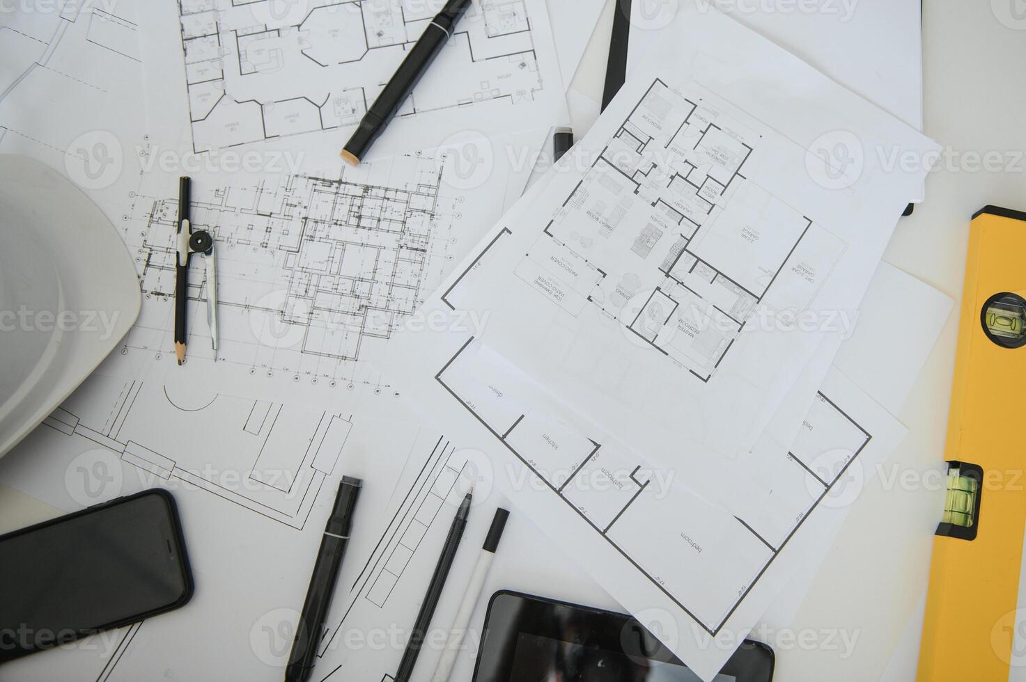 architect design working drawing sketch plans blueprints and making architectural construction model in architect studio,flat lay. photo