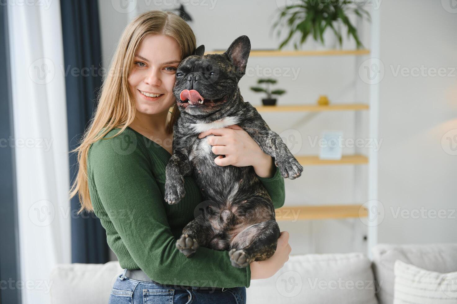 Young woman with her dog at home. Lovely pet photo