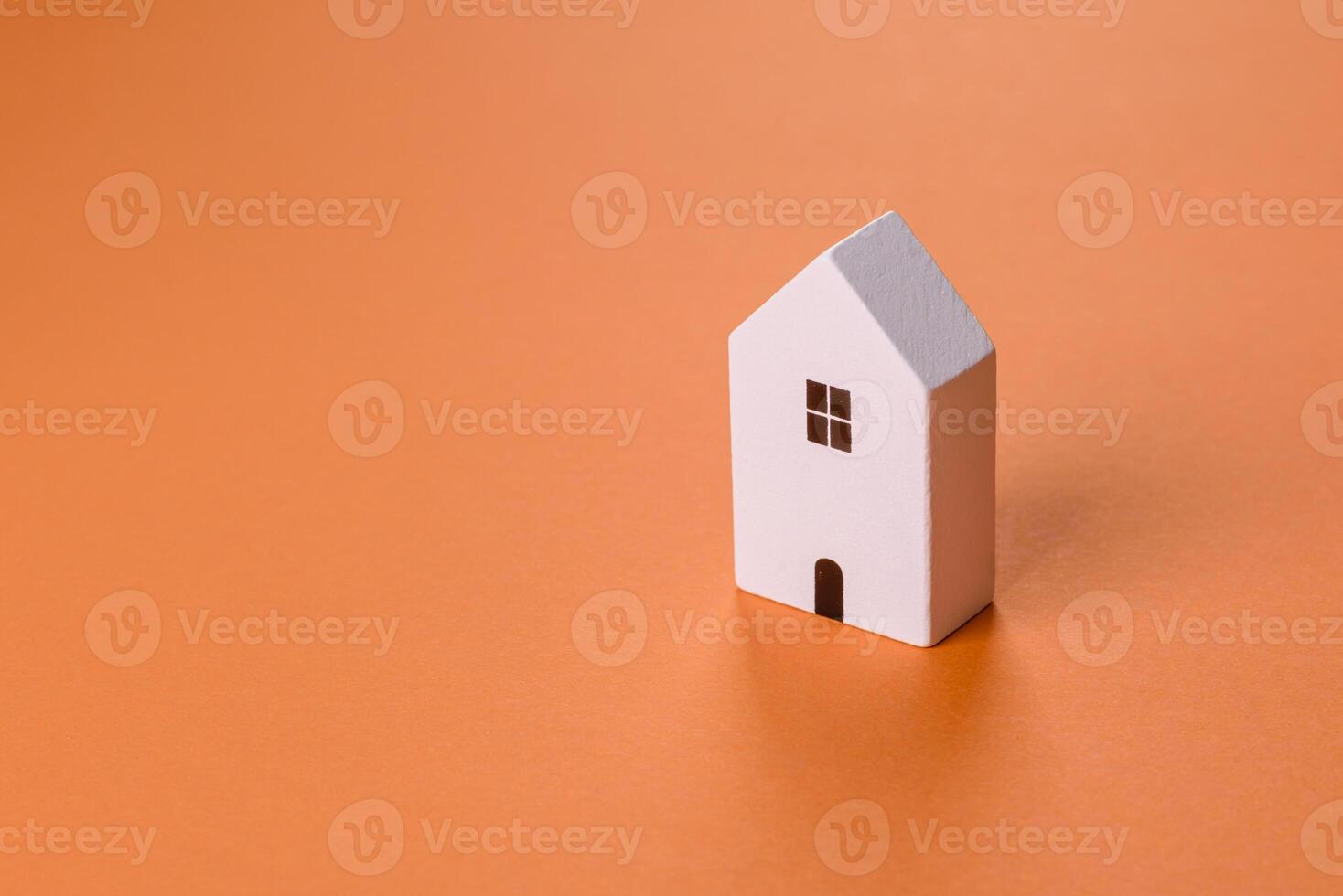 A small wooden house, money and keys as an idea for investing in your own home photo