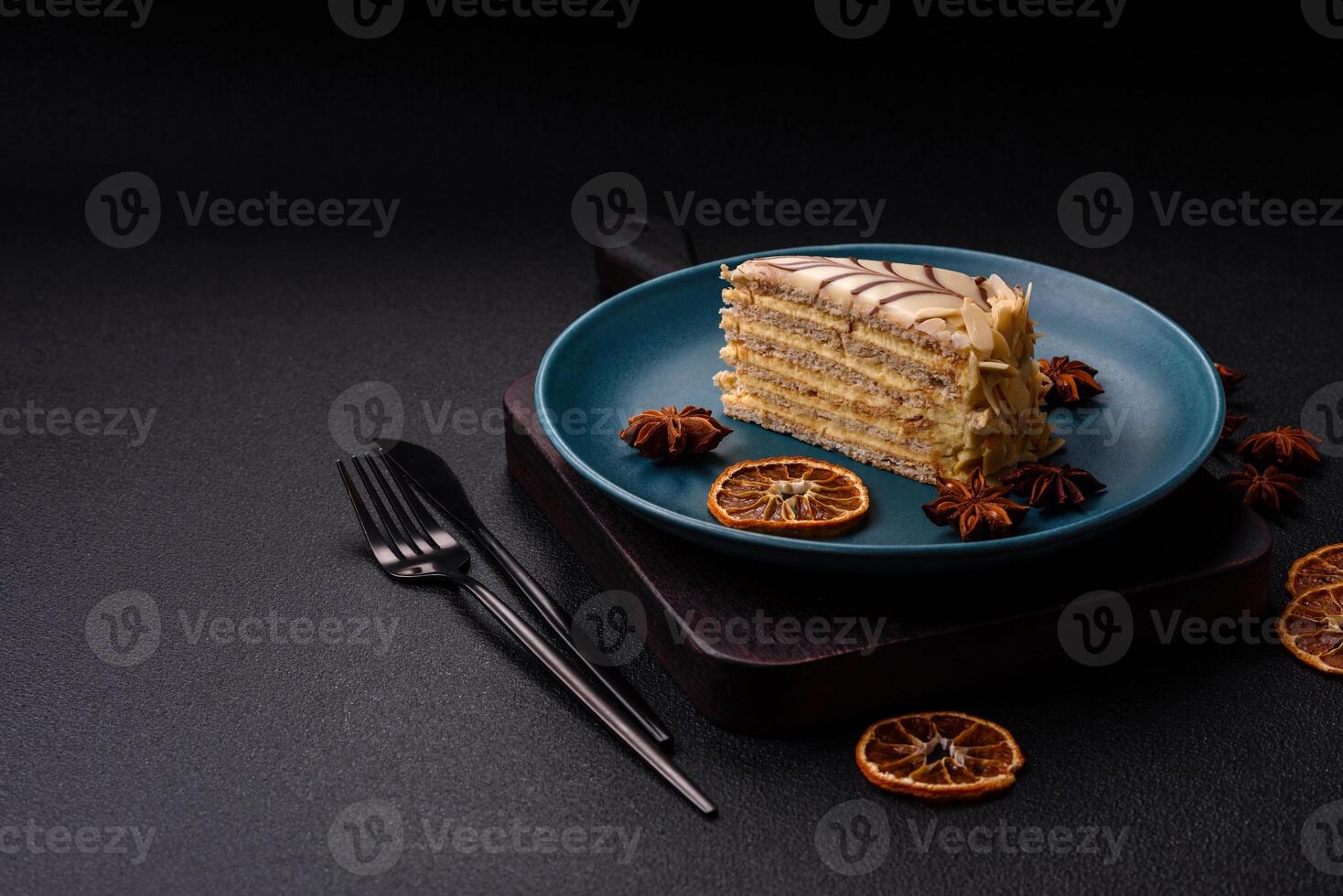 Piece of delicious sweet esterhazy cake with nuts and cream photo