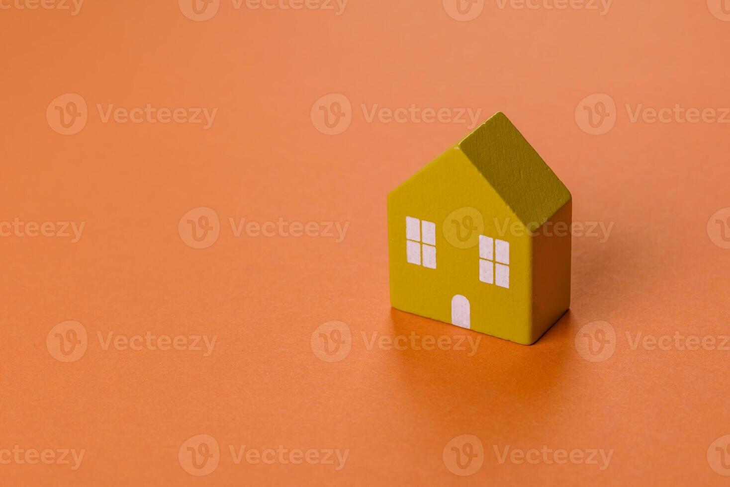 A small wooden house, money and keys as an idea for investing in your own home photo