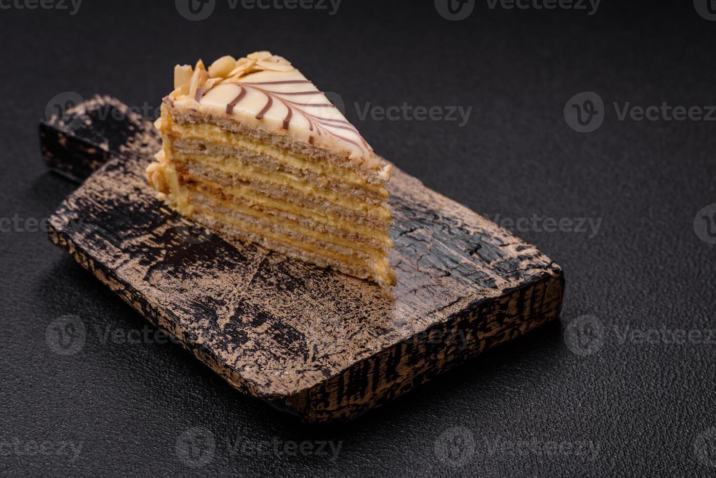 Piece of delicious sweet esterhazy cake with nuts and cream photo