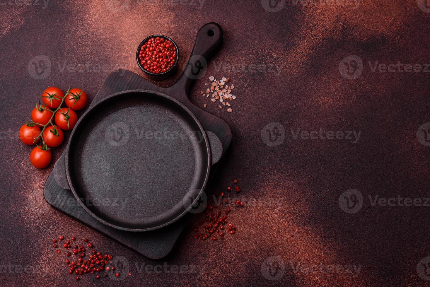 Empty ceramic round plate on dark textured concrete background photo