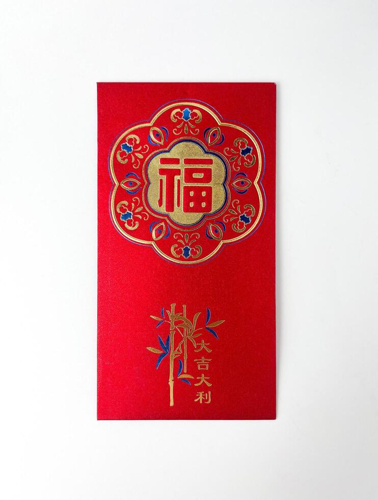 Chinese Lunar New Year CNY red angpao or angbao envelope top front view. Object photography isolated on vertical ratio white studio background. photo