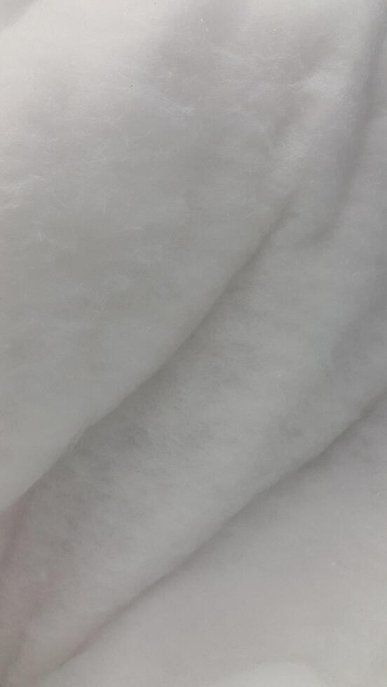 Fluffy texture. Soft white fluffy surface. Fuzzy background photo