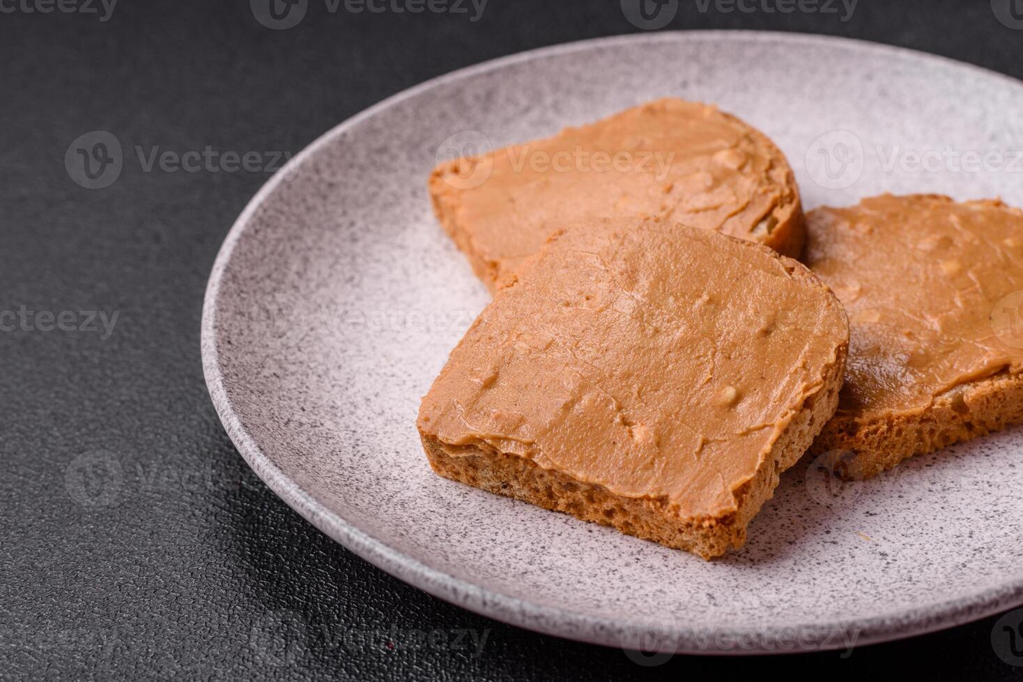 Delicious hearty sandwich with toast bread and peanut butter photo
