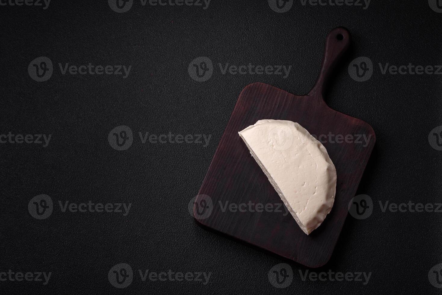 Delicious fresh white young cheese from cow's or sheep's milk photo