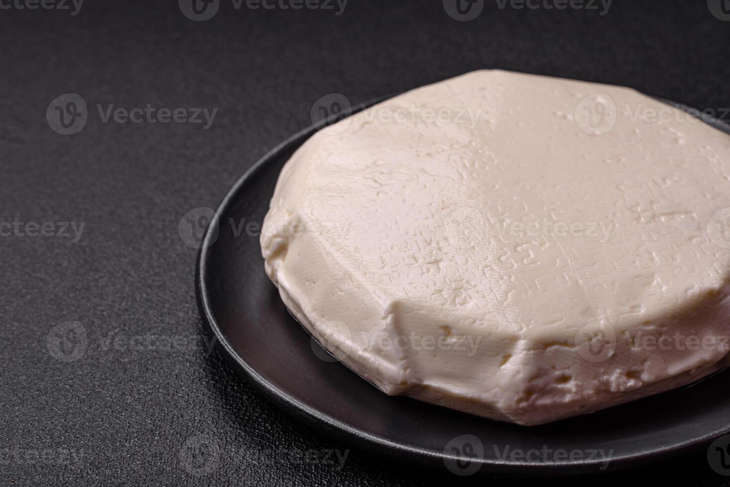 Delicious fresh white young cheese from cow's or sheep's milk photo