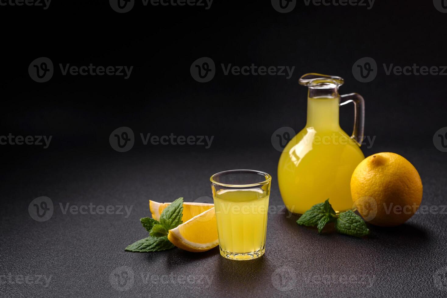 Alcoholic drink yellow limoncello in a small glass photo