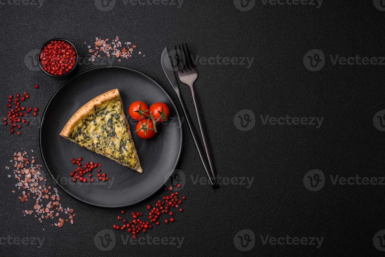Delicious crispy quiche cut into slices with cheese, broccoli, tomatoes photo