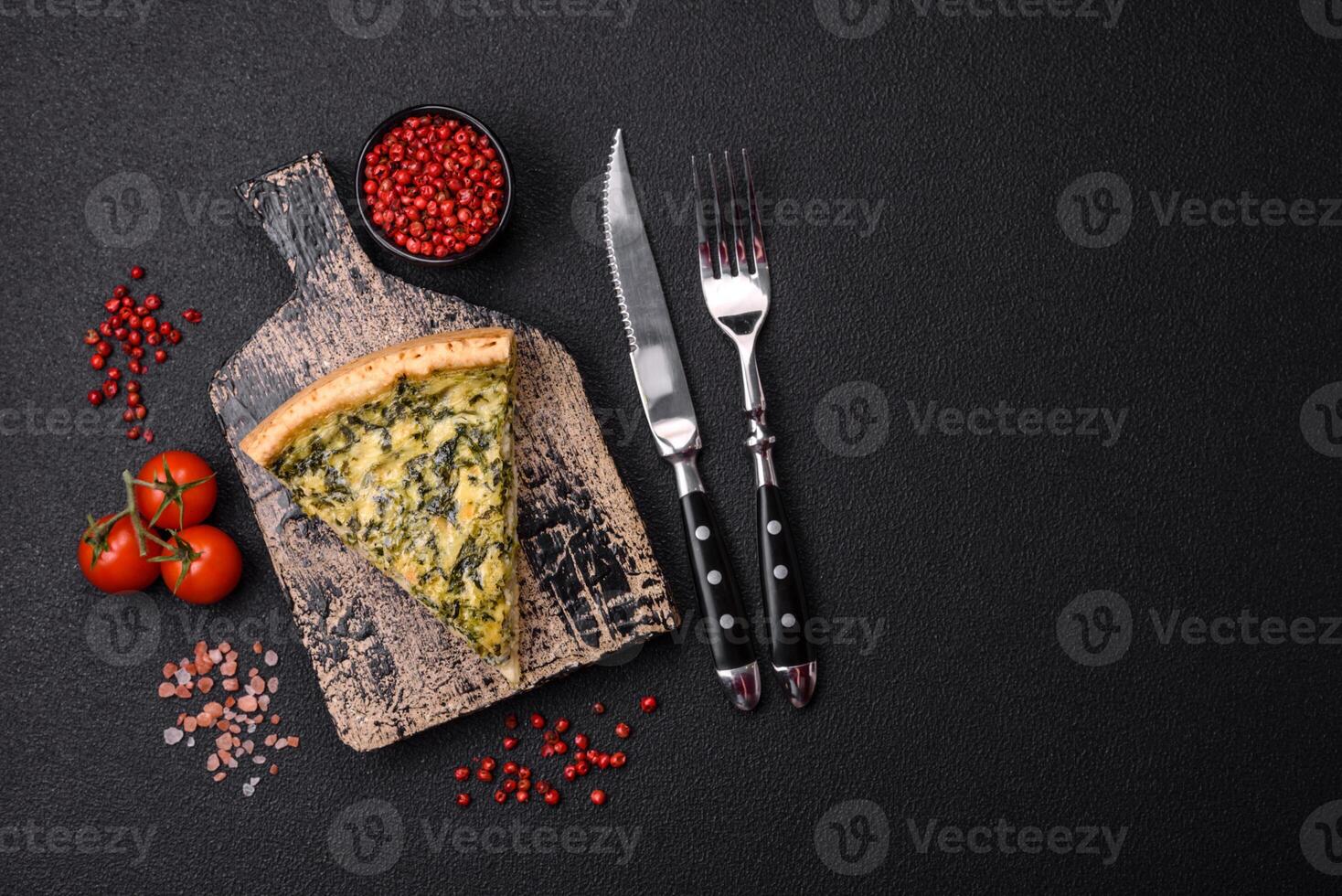 Delicious crispy quiche cut into slices with cheese, broccoli, tomatoes photo