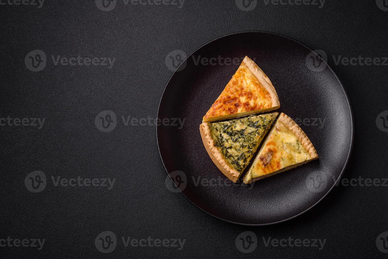 Delicious crispy quiche cut into slices with cheese, broccoli, tomatoes photo