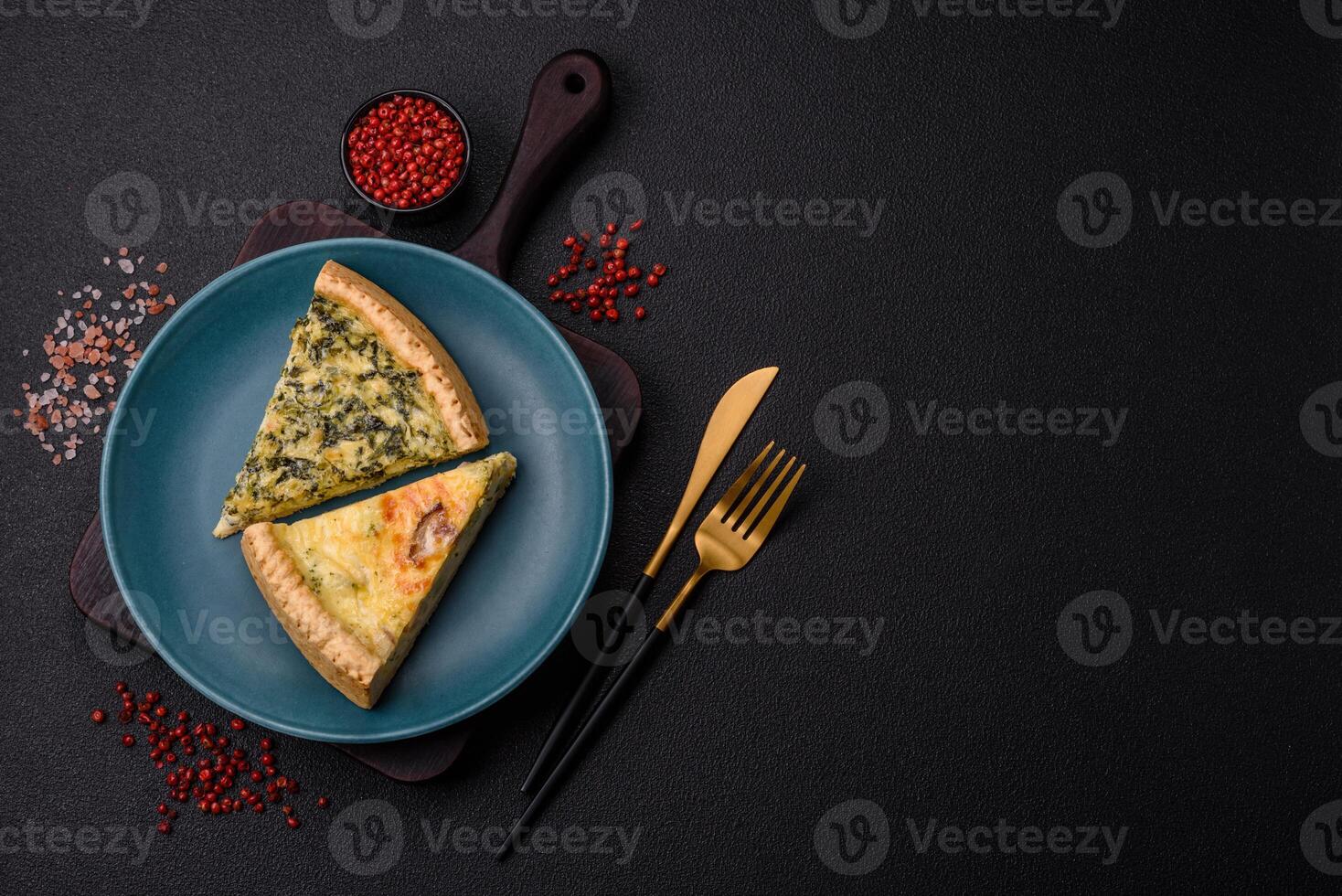 Delicious crispy quiche cut into slices with cheese, broccoli, tomatoes photo