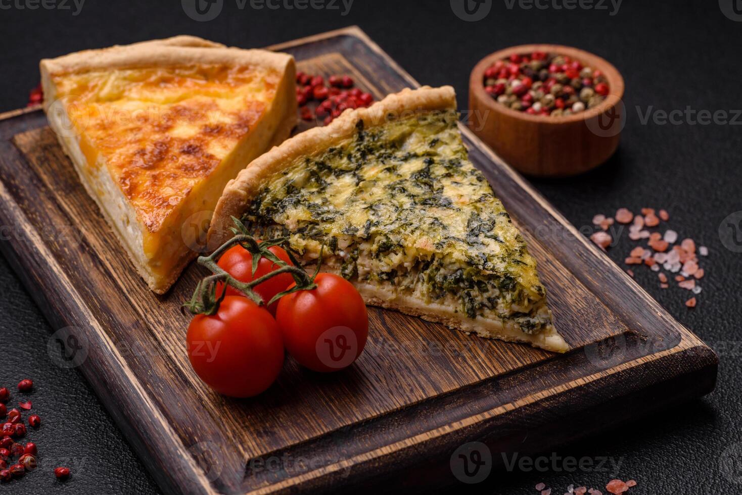 Delicious crispy quiche cut into slices with cheese, broccoli, tomatoes photo