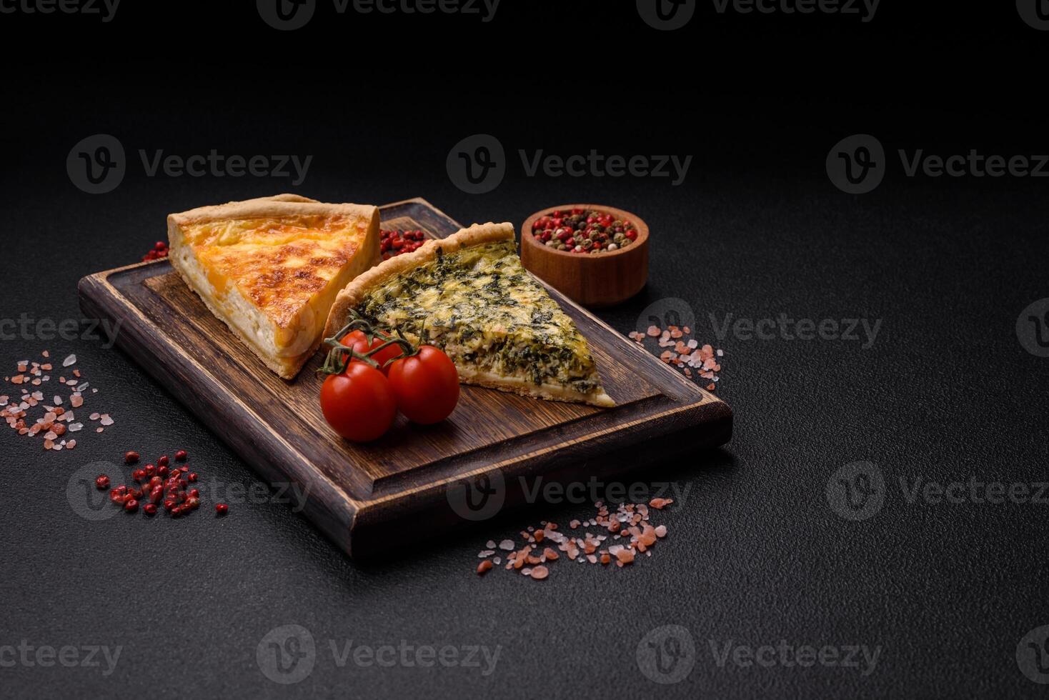 Delicious crispy quiche cut into slices with cheese, broccoli, tomatoes photo