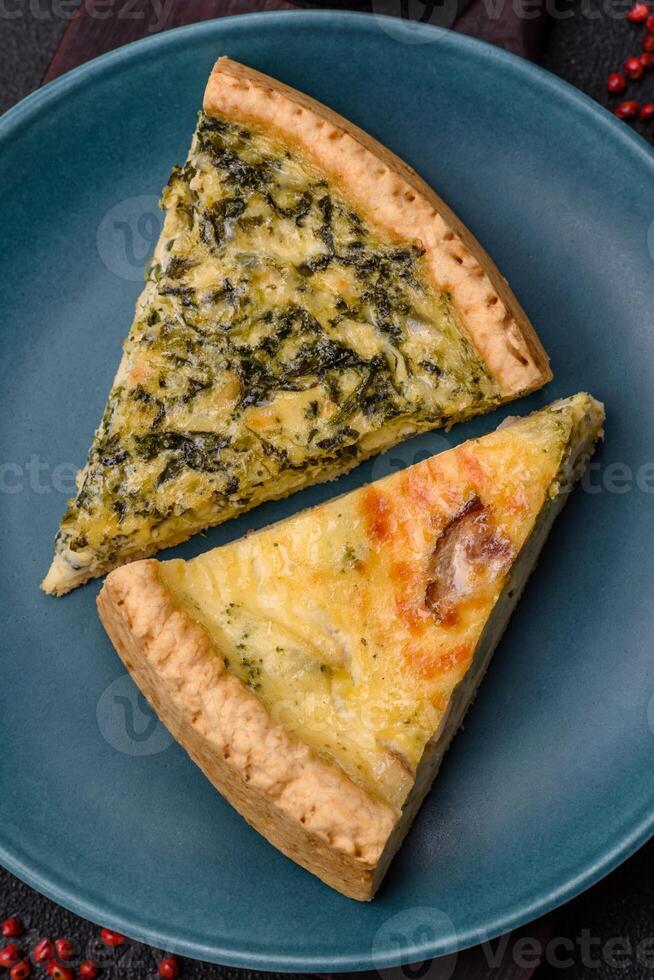 Delicious crispy quiche cut into slices with cheese, broccoli, tomatoes photo