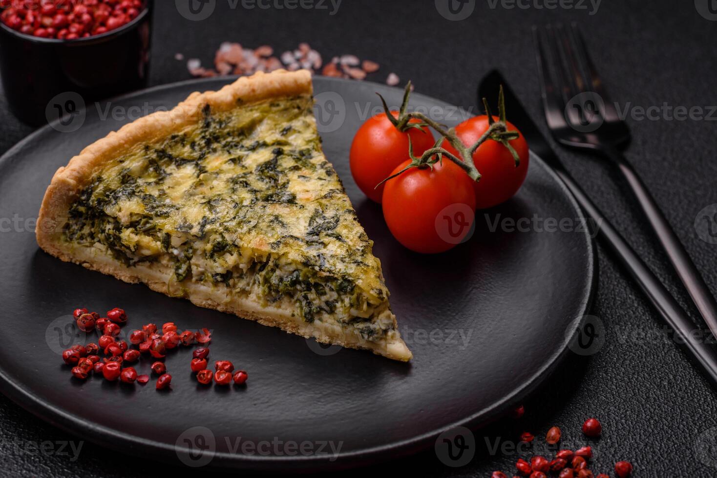 Delicious crispy quiche cut into slices with cheese, broccoli, tomatoes photo