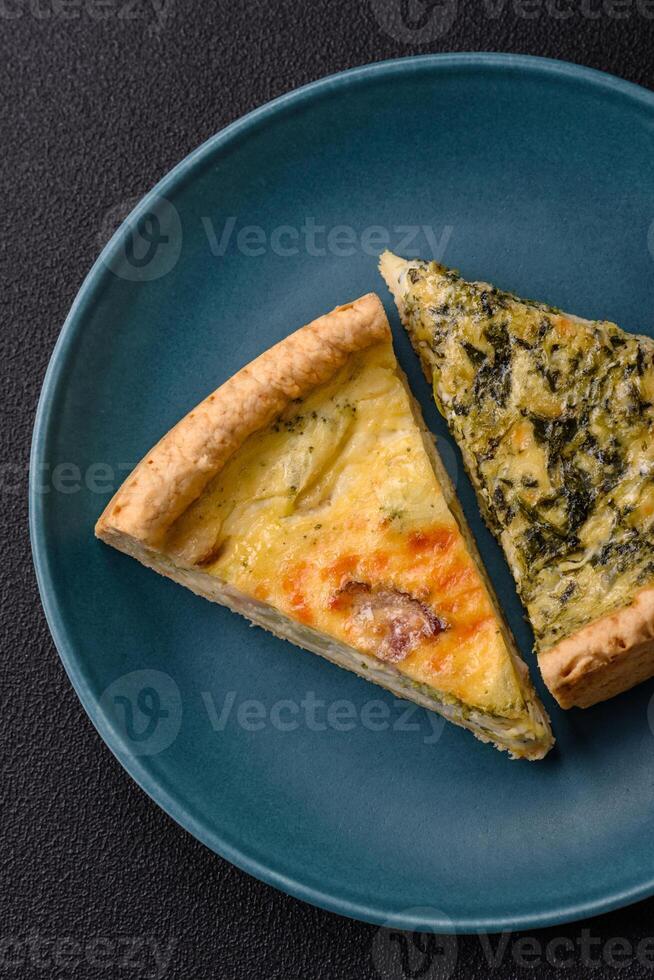 Delicious crispy quiche cut into slices with cheese, broccoli, tomatoes photo
