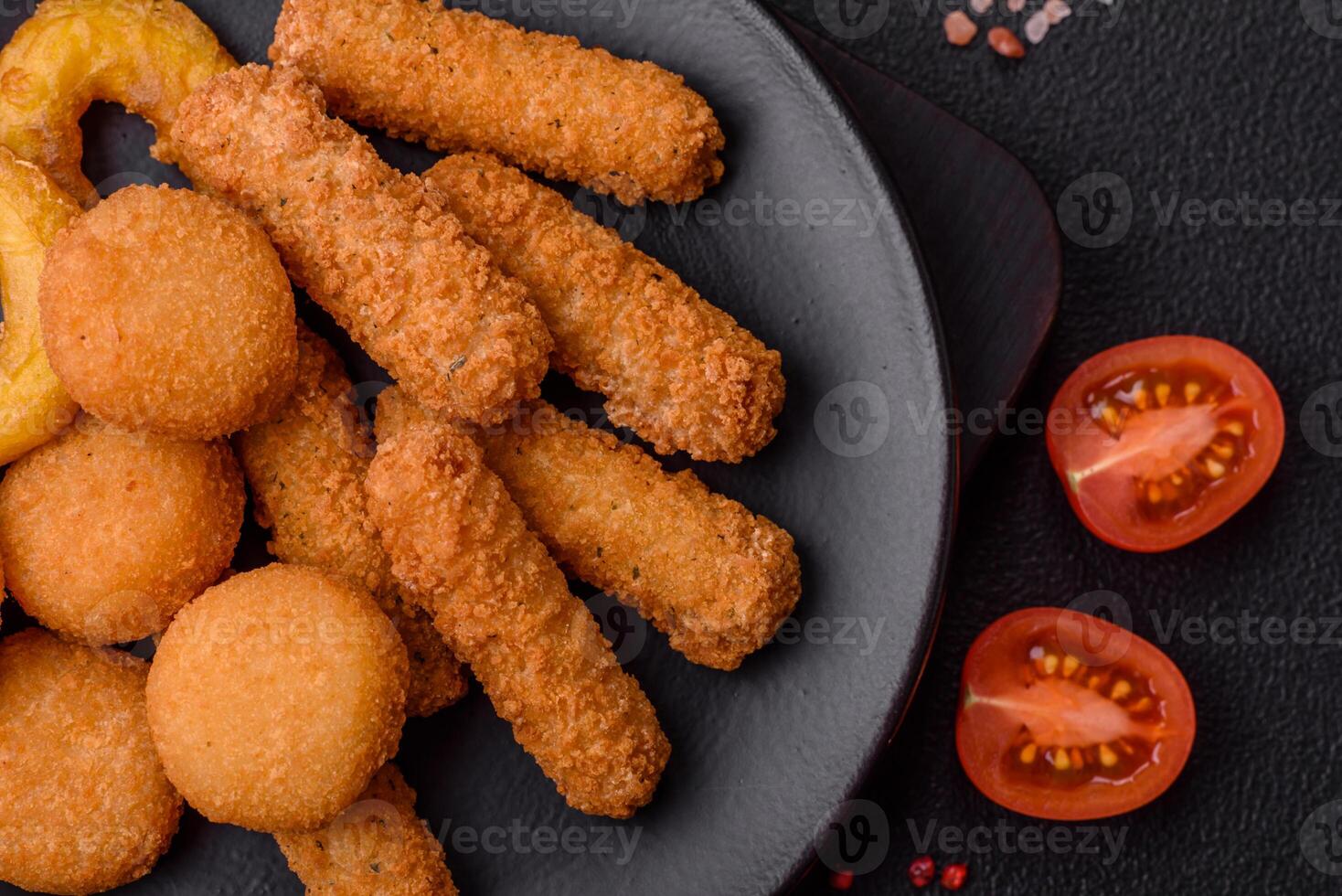 Delicious nuggets, rings and balls of mozzarella and parmesan cheese photo