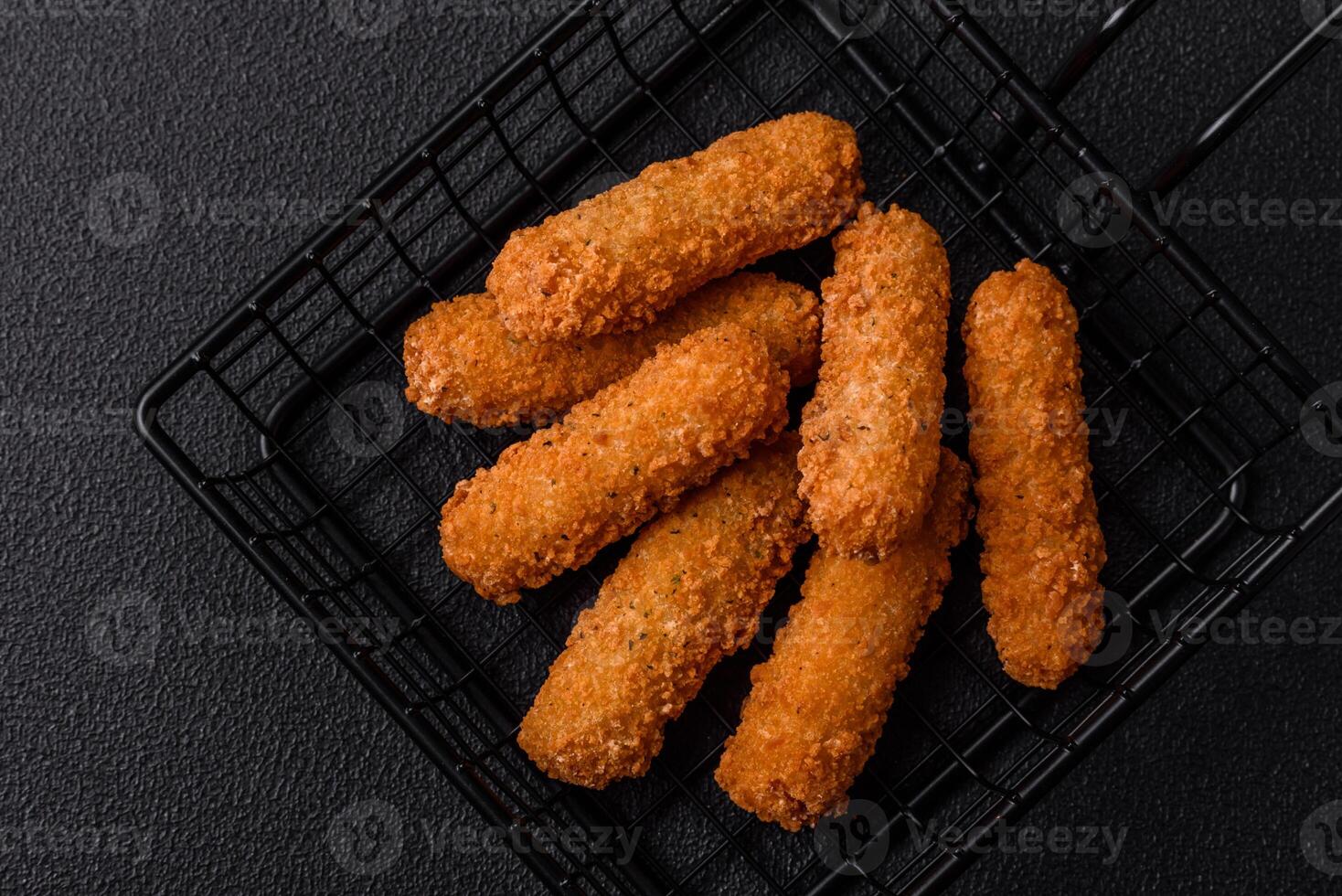 Delicious crispy cheese sticks with mozzarella, salt and spices photo