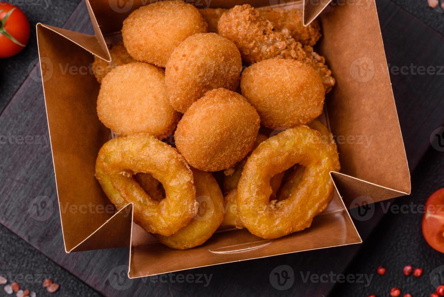 Delicious nuggets, rings and balls of mozzarella and parmesan cheese photo