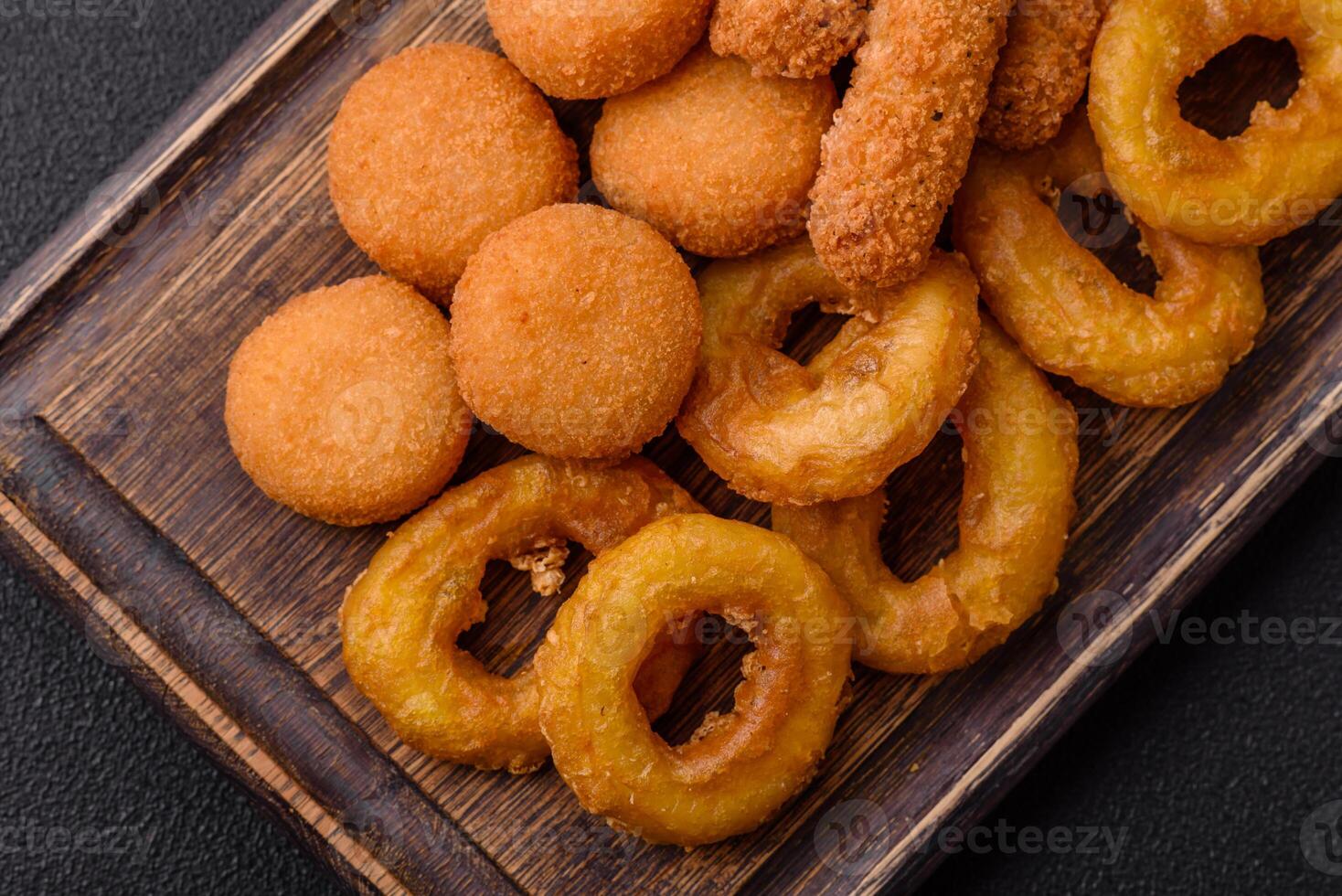 Delicious nuggets, rings and balls of mozzarella and parmesan cheese photo