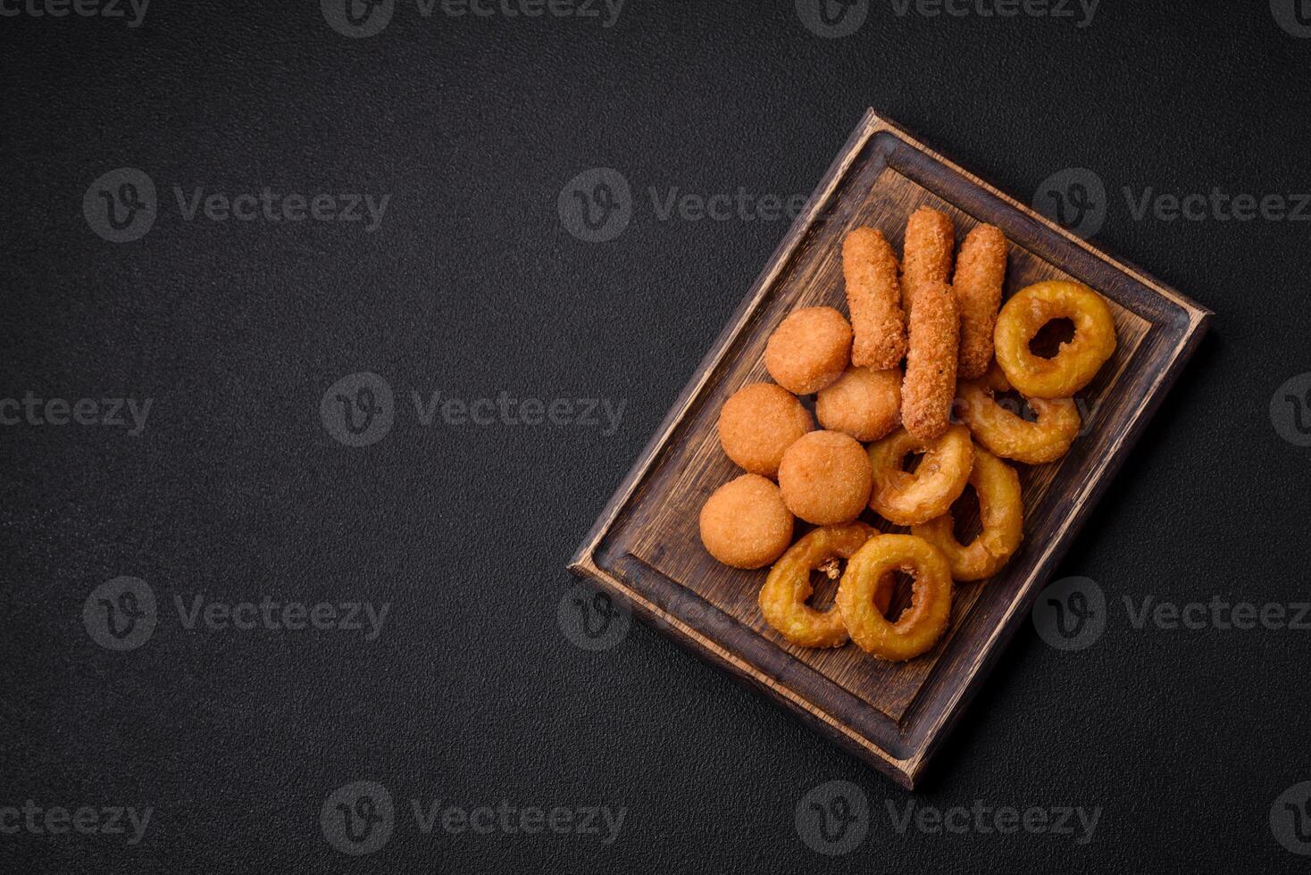 Delicious nuggets, rings and balls of mozzarella and parmesan cheese photo