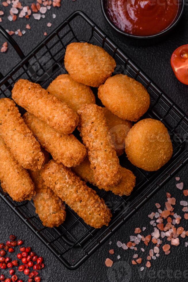 Delicious nuggets, rings and balls of mozzarella and parmesan cheese photo