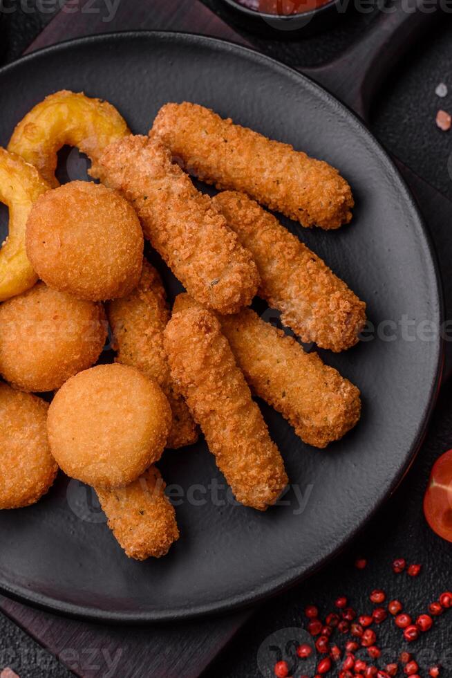 Delicious nuggets, rings and balls of mozzarella and parmesan cheese photo