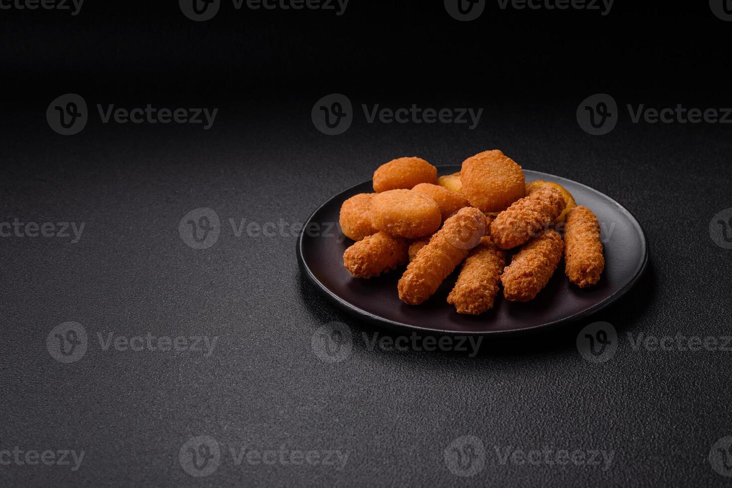 Delicious nuggets, rings and balls of mozzarella and parmesan cheese photo