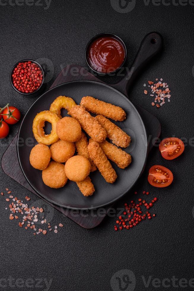 Delicious nuggets, rings and balls of mozzarella and parmesan cheese photo