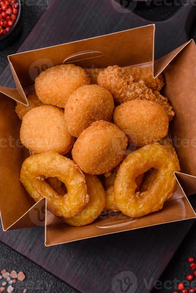 Delicious nuggets, rings and balls of mozzarella and parmesan cheese photo